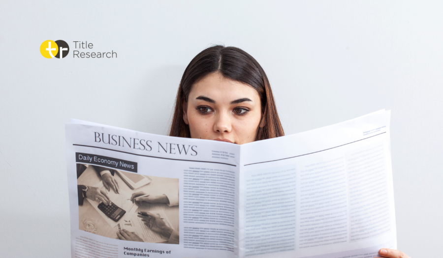 Women reading Business News newspaper