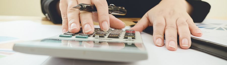 A professional using a calculator